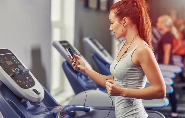 Picture woman, redhead, fitness, exercises, mobile device