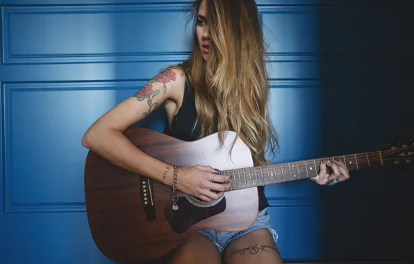 Picture girl, guitar, tattoo, long hair, blue background