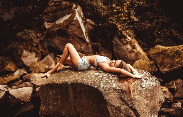 Picture girl, stones, shorts, lies, brown hair, topic, nature, posing