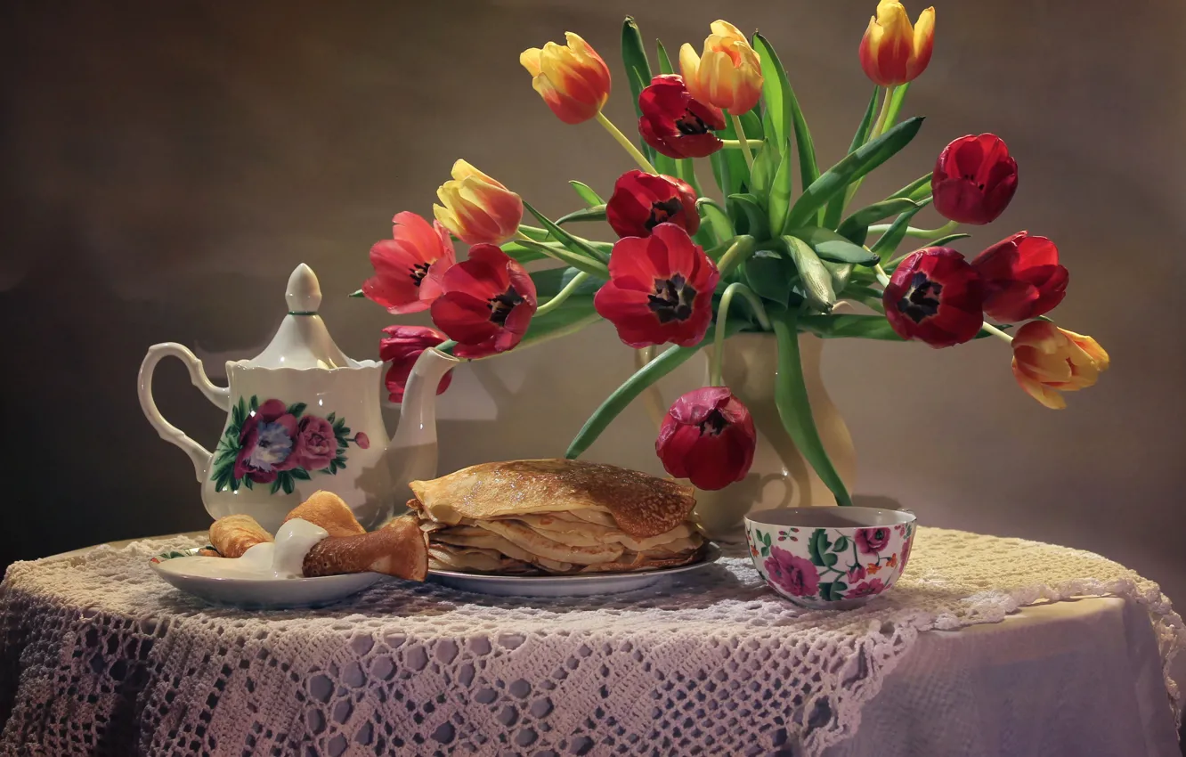 Photo wallpaper flowers, table, background, tea, bouquet, kettle, plate, Cup, tulips, vase, still life, pancakes, saucer, tablecloth, …